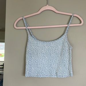 Five Brandy Melville tops, 2 with tags.